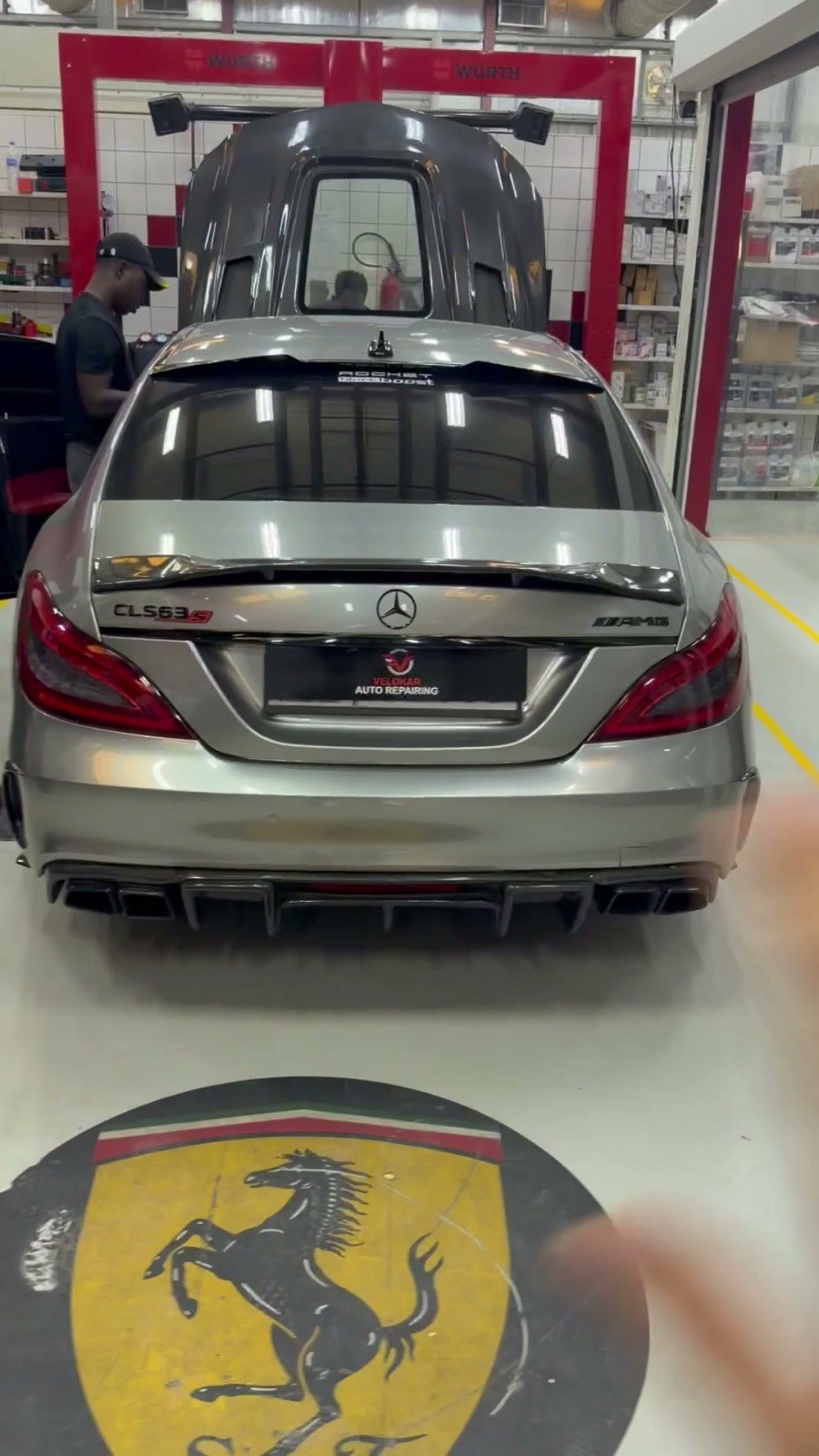 Silver Mercedes CLS 63 AMG in a Velokar workshop bay in Al Quoz