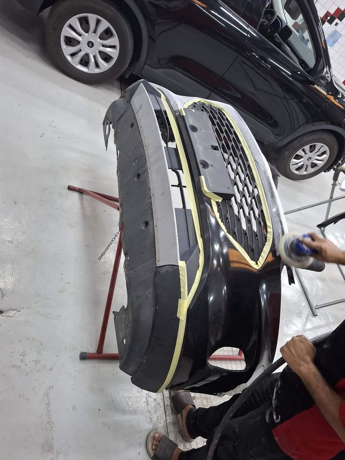 Bumper being prepared and refinished at the Velokar workshop