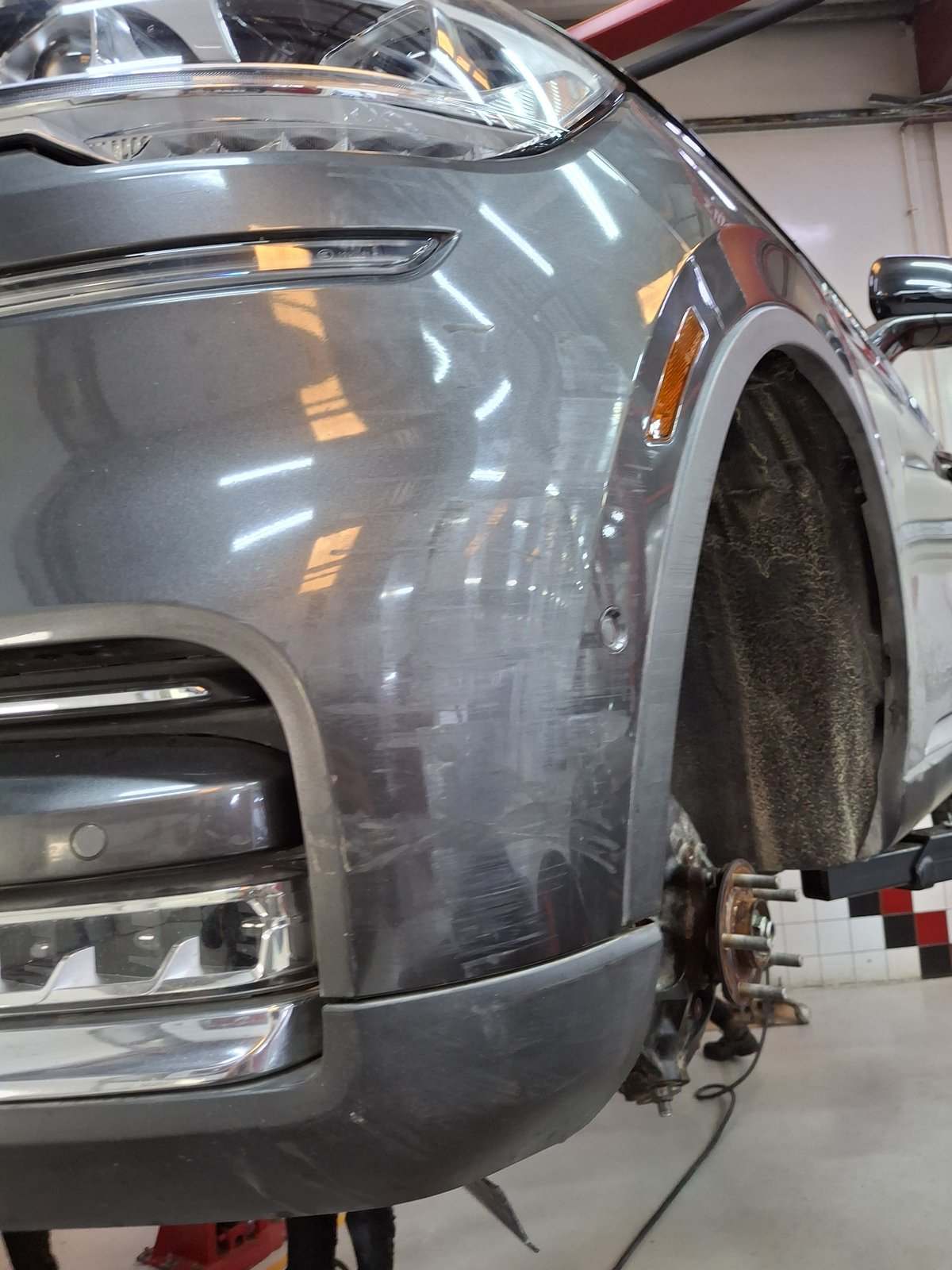 SUV with fender removed during body repair at Velokar in Al Quoz