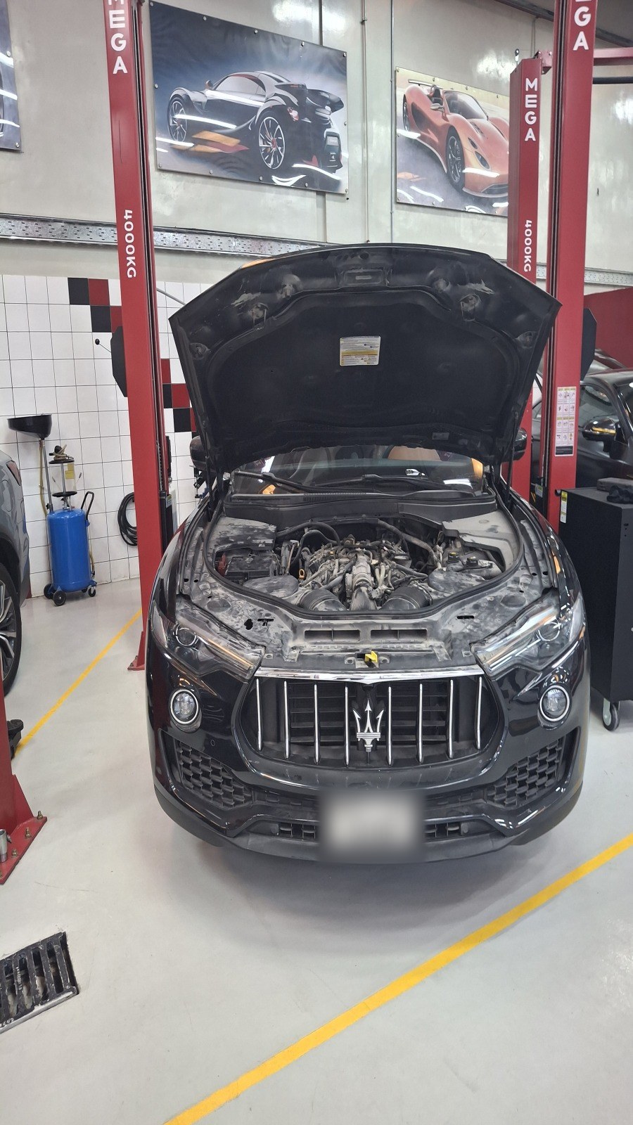 Maserati Levante on the lift with the bonnet open at Velokar in Al Quoz