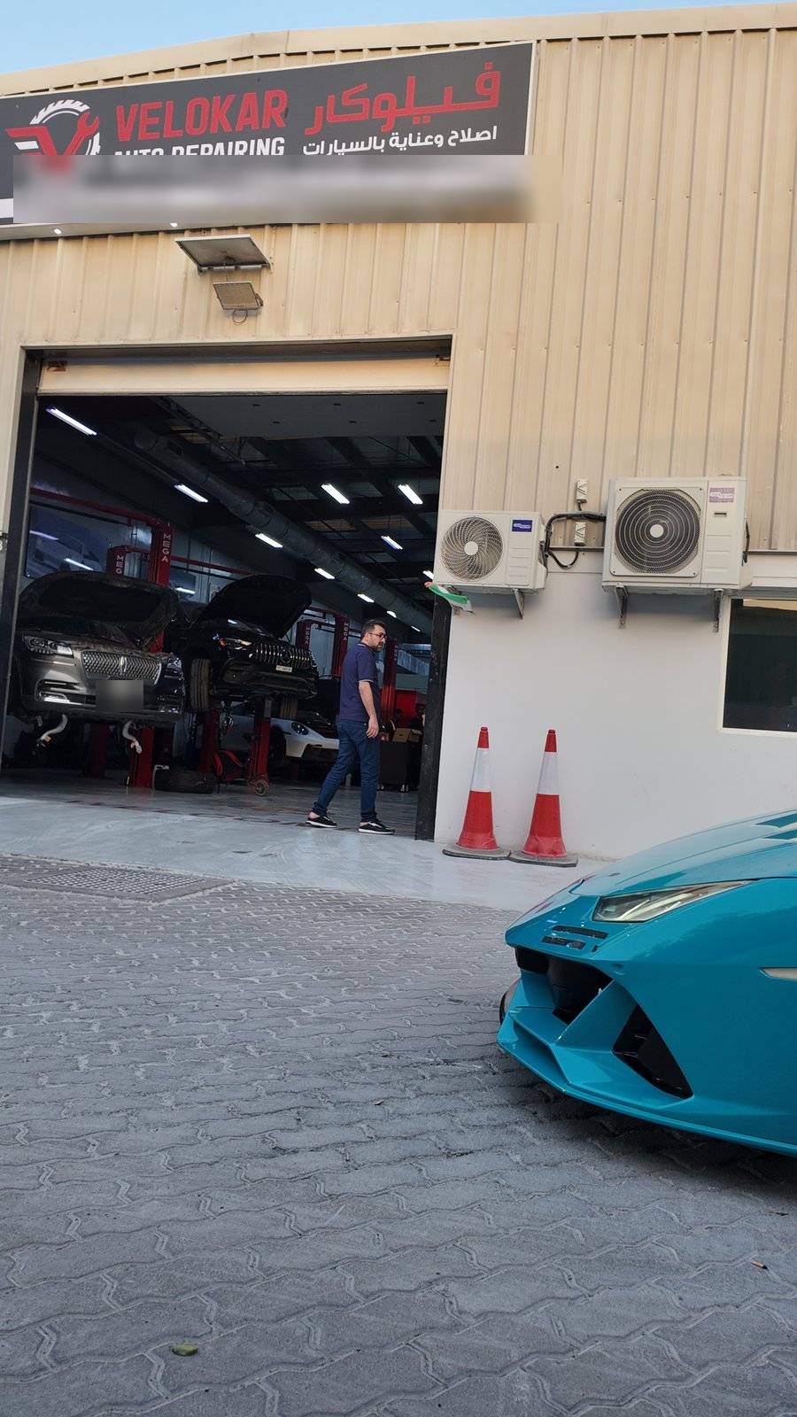 Velokar Auto Repairing workshop front in Al Quoz with a Lamborghini Huracan