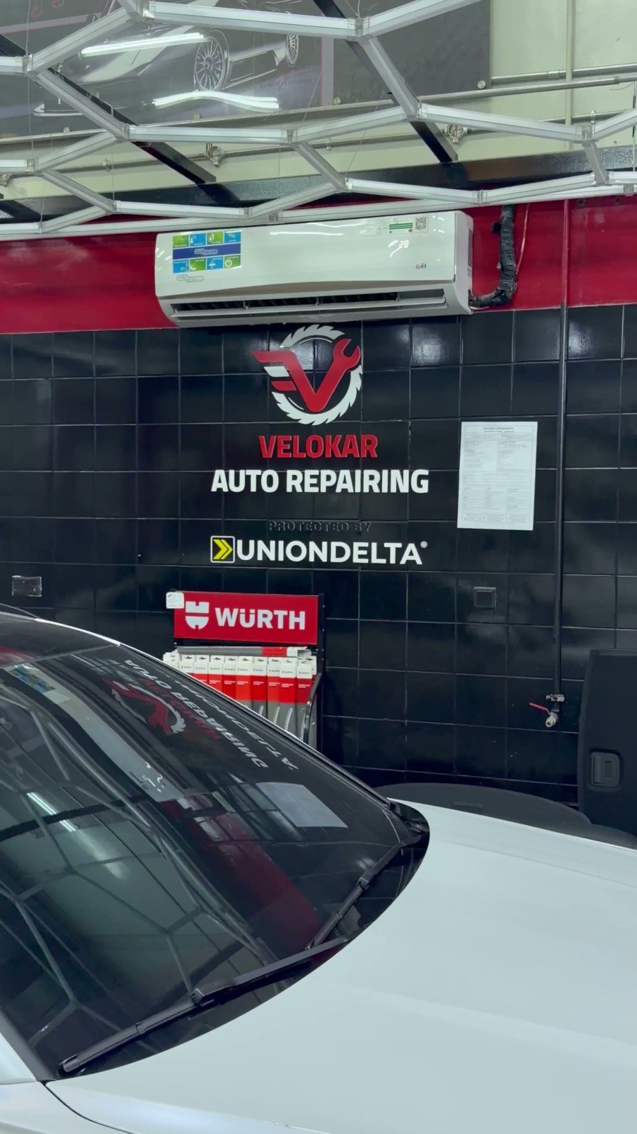 The Velokar Auto Repairing sign on the workshop wall in Al Quoz Industrial 3, Dubai