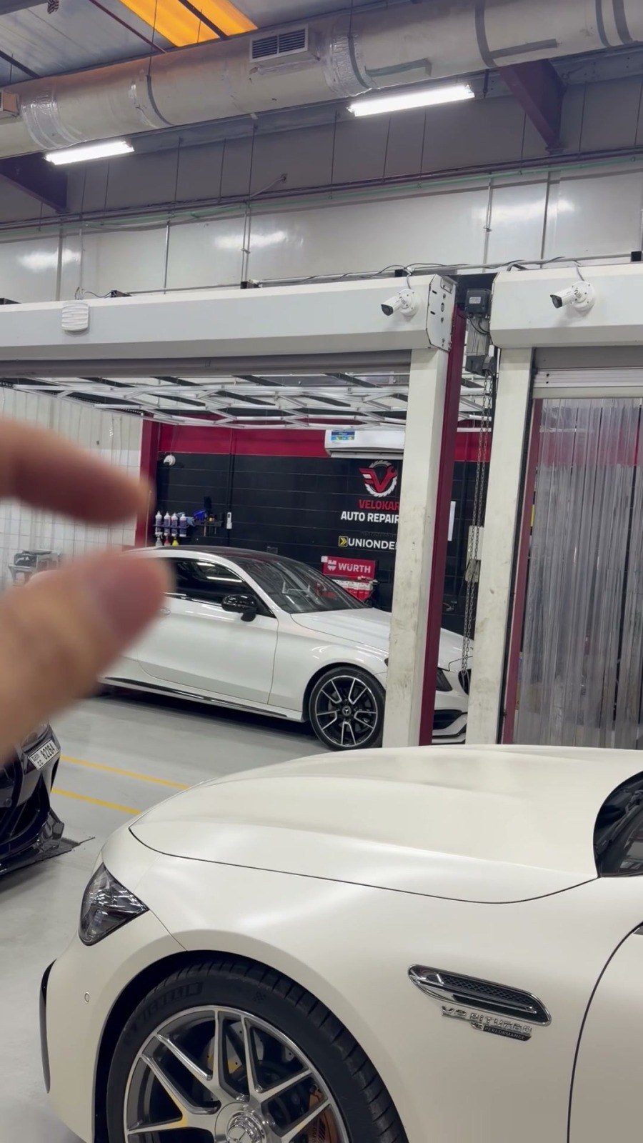 Cars in the service bays of the Velokar workshop, Al Quoz