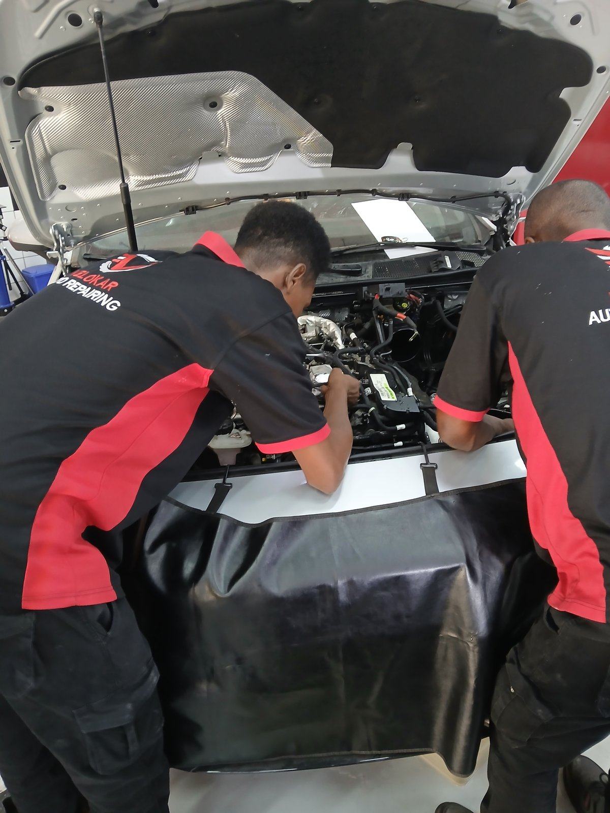 Velokar team diagnosing a Mercedes engine bay