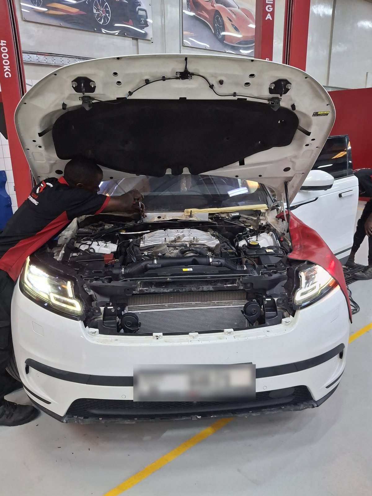 Range Rover Velar with front end stripped during cooling system repair at Velokar Dubai